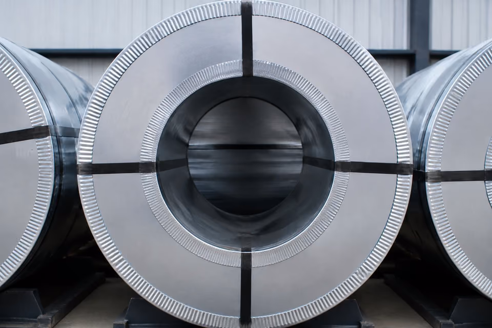 Front view of a galvanized steel coil in storage