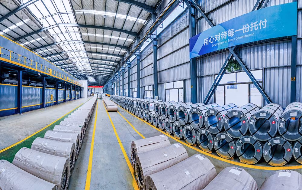 Steel coils being loaded onto a truck inside the Huiding Steel facility